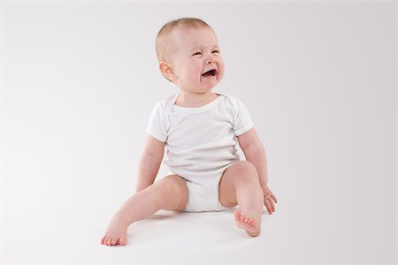 sad child sitting - Baby crying Stock Photo - Premium Royalty-Free, Code: 614-02985027