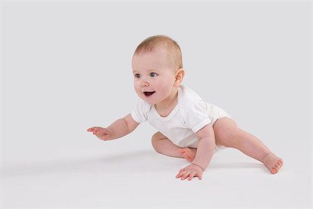 striscia - Baby crawling Fotografie stock - Premium Royalty-Free, Codice: 614-02985022