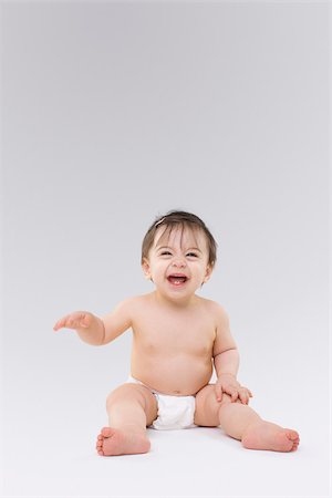 diapered girls - Baby laughing Stock Photo - Premium Royalty-Free, Code: 614-02985037