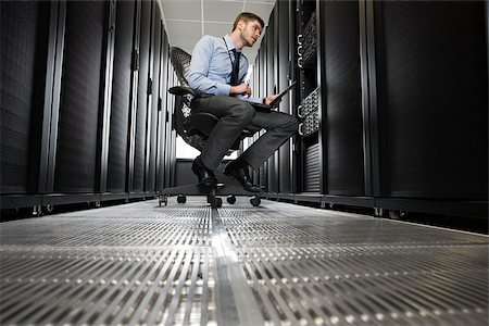 server room - Computer technician working on a server Stock Photo - Premium Royalty-Free, Code: 614-02985069