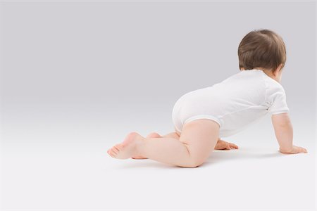 Baby crawling Stock Photo - Premium Royalty-Free, Code: 614-02985063