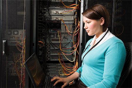 person in a server room - Female computer technician Stock Photo - Premium Royalty-Free, Code: 614-02985104