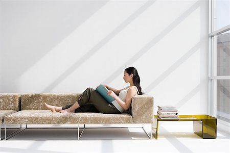 simsearch:614-02985277,k - Woman reading on a sofa Stock Photo - Premium Royalty-Free, Code: 614-02985269