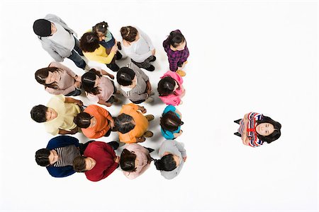 remote control, white background - Woman in front of crowd Stock Photo - Premium Royalty-Free, Code: 614-02983839