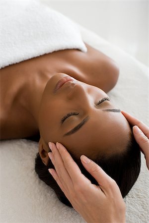 Woman having a head massage Stock Photo - Premium Royalty-Free, Code: 614-02983946
