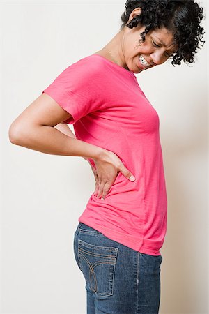 Woman with a backache Foto de stock - Sin royalties Premium, Código: 614-03020230