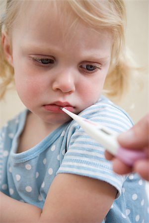 sick child with parent - Girl having her temperature taken Stock Photo - Premium Royalty-Free, Code: 614-03020250