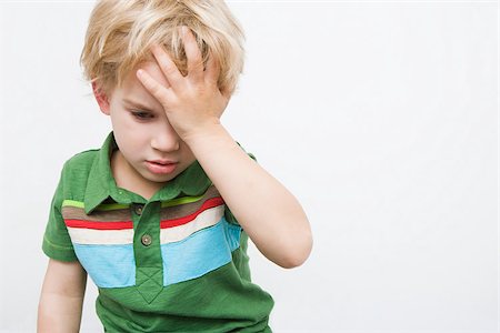 perturbación - Boy with hand on head Stock Photo - Premium Royalty-Free, Code: 614-03020423