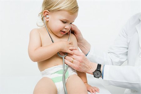 pediatric doctor boy exam - Little boy with stethoscope Stock Photo - Premium Royalty-Free, Code: 614-03020439