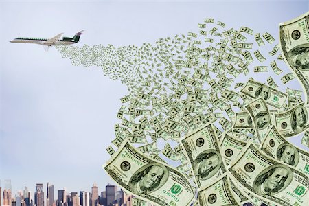 Airplane dropping money over city Foto de stock - Sin royalties Premium, Código: 614-03020583