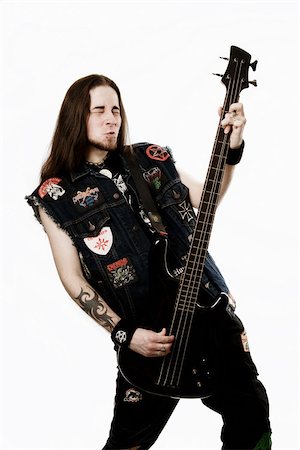 electric bass white background - Heavy metal bass player Stock Photo - Premium Royalty-Free, Code: 614-03080784