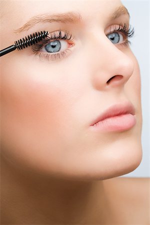 eye and lashes and close up - Woman applying mascara Stock Photo - Premium Royalty-Free, Code: 614-03080799