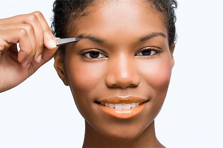 plucked - Young woman plucking eyebrows Foto de stock - Sin royalties Premium, Código: 614-03080793