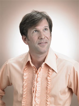 peach color - Portrait of a mature man Stock Photo - Premium Royalty-Free, Code: 614-03191080