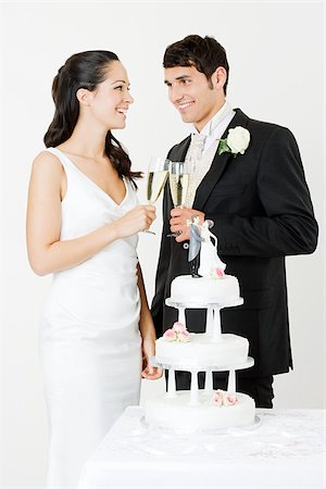 Bride and groom toasting with champagne Stock Photo - Premium Royalty-Free, Code: 614-03191782