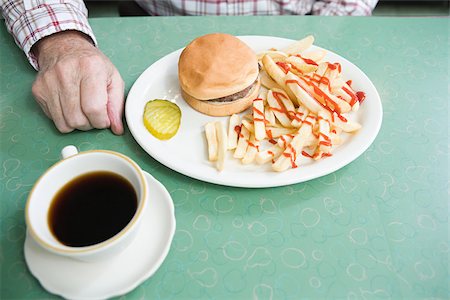 picture of man sitting alone diner - Burger and fries Stock Photo - Premium Royalty-Free, Code: 614-03228171