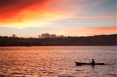 fishing dawn tranquil - Sunset on fishing boat on lake toba indonesia Stock Photo - Premium Royalty-Free, Code: 614-03241259