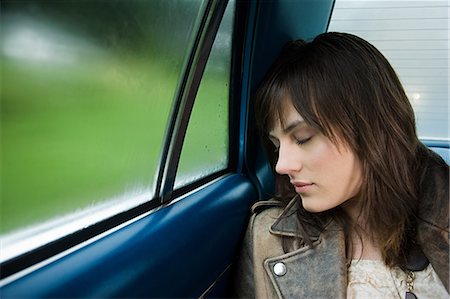 rain and car people - Young woman asleep in car Stock Photo - Premium Royalty-Free, Code: 614-03241337
