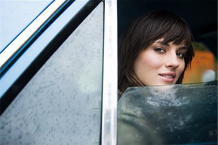 person car rain - Young woman in car Stock Photo - Premium Royalty-Free, Code: 614-03241373