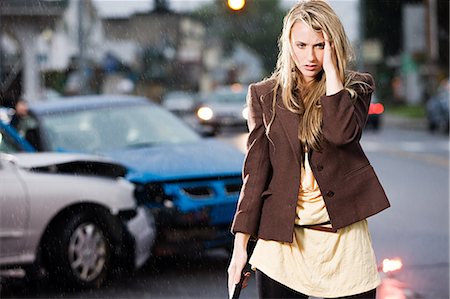 rain and car people - Young woman who has been in an accident Stock Photo - Premium Royalty-Free, Code: 614-03241420