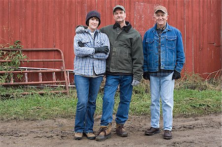 farmers in barn - Three farmers Stock Photo - Premium Royalty-Free, Code: 614-03359449