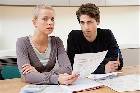 Young couple doing home finances Stock Photo - Premium Royalty-Free, Code: 614-03359717