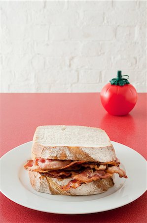 still life meat tomato - Bacon sandwich Stock Photo - Premium Royalty-Free, Code: 614-03359953