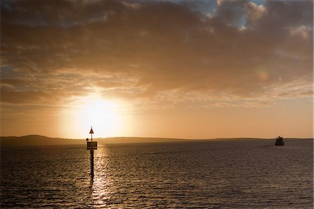 Fishing boat heading out to sea. Stock Photo - Premium Royalty-Free, Code: 614-03360029