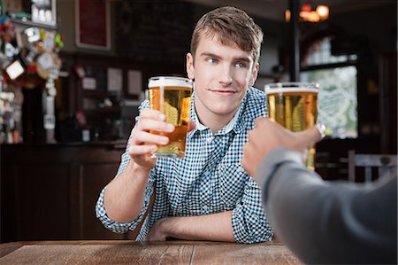 public house - Young men in bar Stock Photo - Premium Royalty-Free, Code: 614-03393405