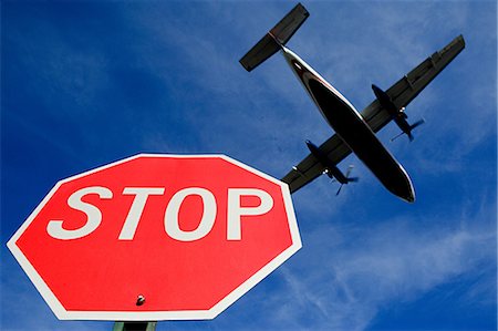 stopping - Airplane and stop sign Stock Photo - Premium Royalty-Free, Code: 614-03393523