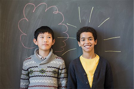 Two boys by a blackboard Stock Photo - Premium Royalty-Free, Code: 614-03393639