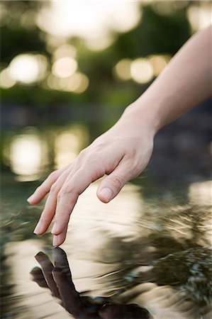 finger lakes - Female hand and water Stock Photo - Premium Royalty-Free, Code: 614-03468645