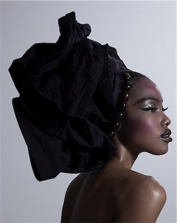 profile woman head and shoulders one person studio shot side view looking away - Young woman wearing head tie Stock Photo - Premium Royalty-Free, Code: 614-03468673