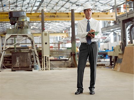 string (clothing) - Mature man with clipboard in factory Stock Photo - Premium Royalty-Free, Code: 614-03507365