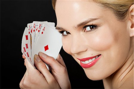 Young blonde woman playing cards Fotografie stock - Premium Royalty-Free, Codice: 614-03507586