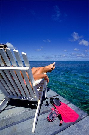 Woman relaxes on dock. Stock Photo - Premium Royalty-Free, Code: 614-03551524