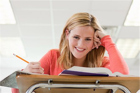 High school student sitting in classroom Stock Photo - Premium Royalty-Free, Code: 614-03551942