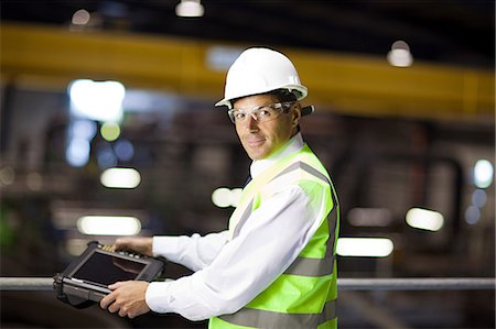 engineer tablet - Engineer with handheld computer Stock Photo - Premium Royalty-Free, Code: 614-03552208