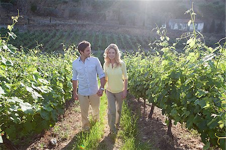 Couple in a sunlit vineyard Stock Photo - Premium Royalty-Free, Code: 614-03552327