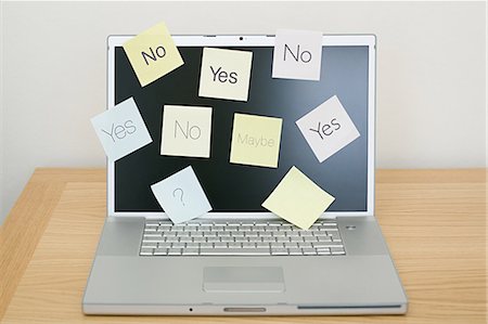 question - Adhesive notes on laptop Stock Photo - Premium Royalty-Free, Code: 614-03577087