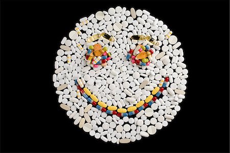 Happy face made from pills Stock Photo - Premium Royalty-Free, Code: 614-03577279