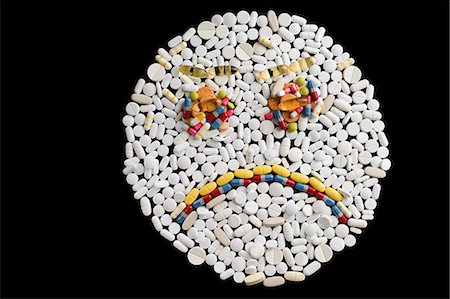 silhouette sad - Sad face made from pills Stock Photo - Premium Royalty-Free, Code: 614-03577280