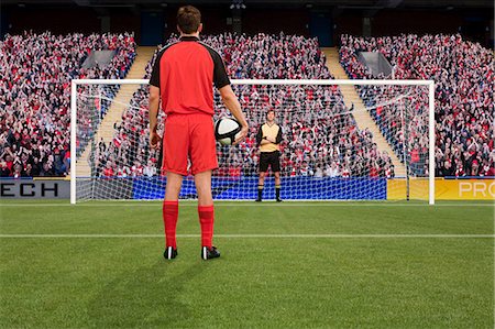 person playing soccer standing back - Goalkeeper anticipating free kick Stock Photo - Premium Royalty-Free, Code: 614-03647738