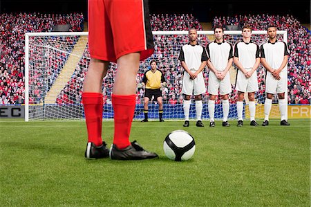 soccer game - Free kick during a football match Stock Photo - Premium Royalty-Free, Code: 614-03647753