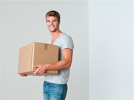 simsearch:614-03648212,k - Young man with cardboard box Stock Photo - Premium Royalty-Free, Code: 614-03648214