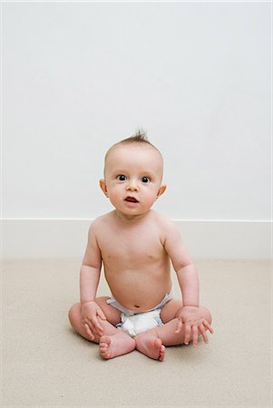 sitting baby diaper - Baby Stock Photo - Premium Royalty-Free, Code: 614-03648670