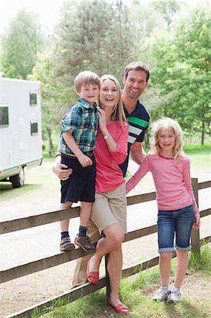 summer adult fence - Happy family on caravan holiday Stock Photo - Premium Royalty-Free, Code: 614-03648914