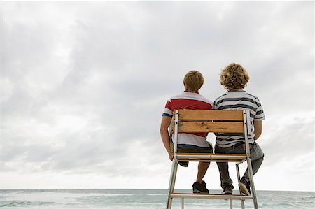 Two boys on lifeguard tower Stock Photo - Premium Royalty-Free, Code: 614-03648995