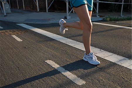 running, legs - Legs of runner on road Stock Photo - Premium Royalty-Free, Code: 614-03649223