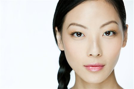 Face of a young chinese woman Stock Photo - Premium Royalty-Free, Code: 614-03649525